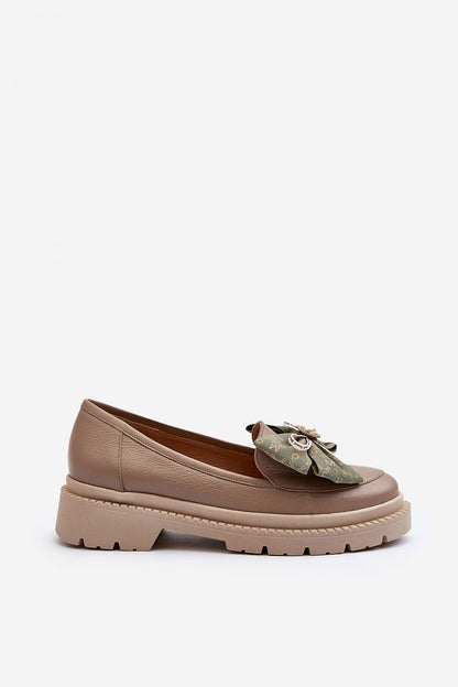 Refined side view of luxury women's natural leather moccasins featuring a sophisticated bow detail, designed for comfort by Step in Style.