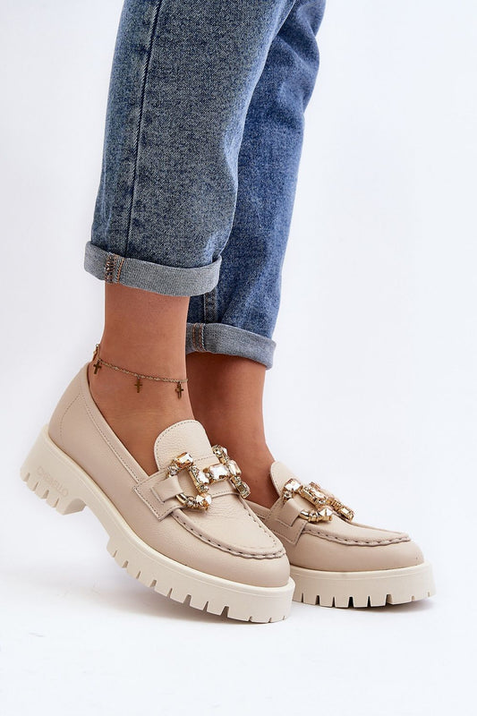 Elegant CheBello natural leather moccasins showcased in a stylish outfit, featuring a decorative front and flat heel, perfect for sophisticated spring attire.