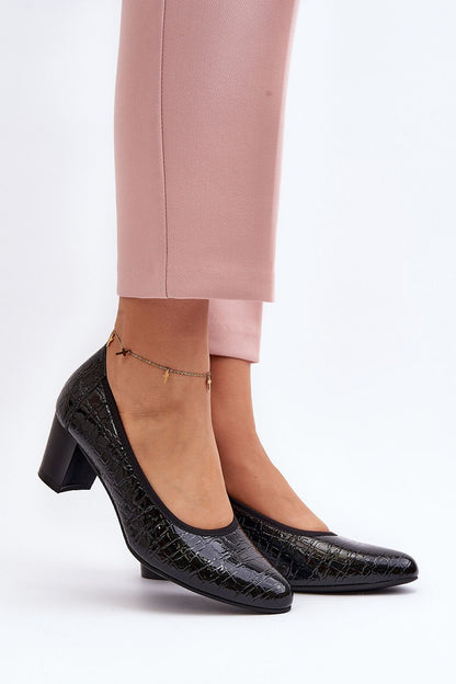 Stylish black block heel pumps with almond toe, beautifully paired with pink trousers, showcasing elegance from Step in Style.