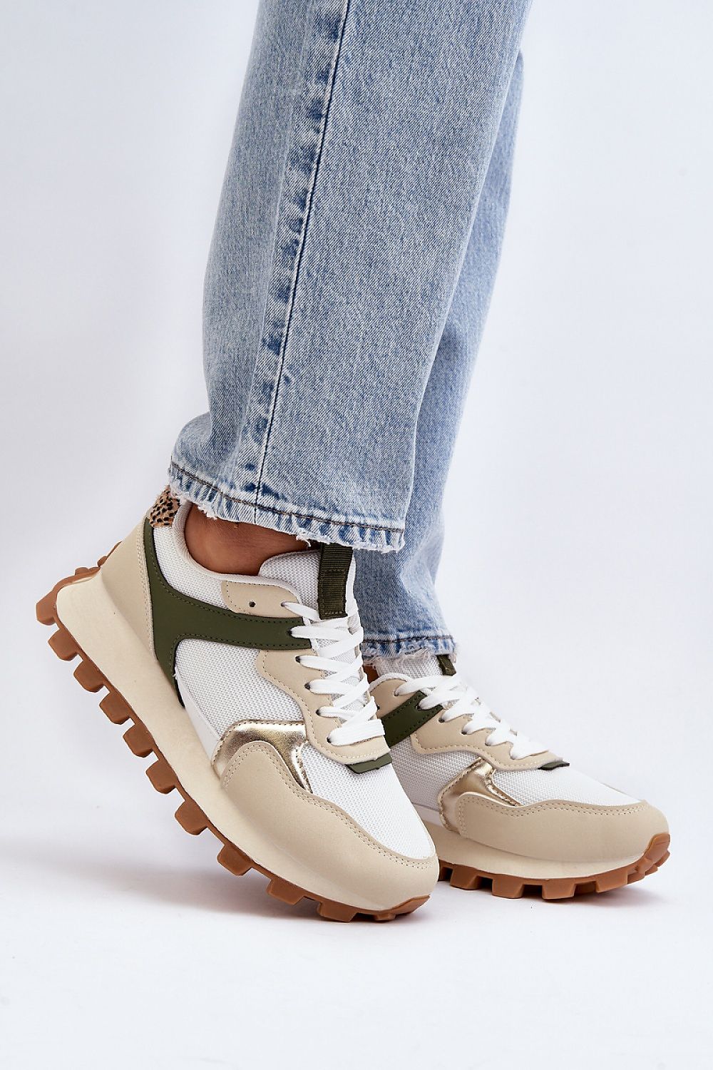 Elegant women's eco leather sneakers by Step in Style, featuring a foam insole for comfort, styled with rounded noses, paired with casual denim for a chic spring-summer look.
