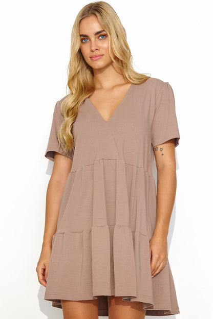 Chic summer daydress by Makadamia in a soft taupe shade, highlighting a v-neck and tiered hem for a trendy look.