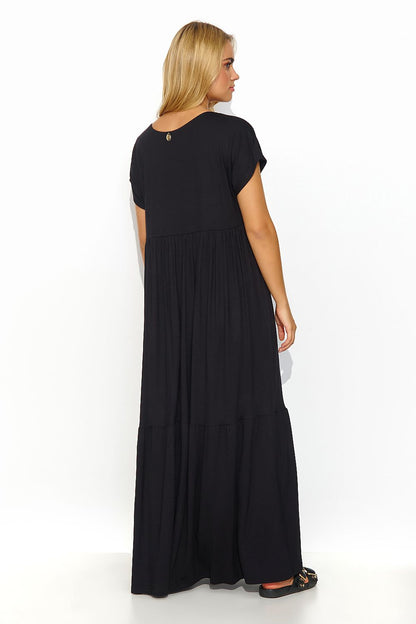 Back view of the luxurious black maxi dress by Makadamia, showcasing a minimalist gold-plated detail and relaxed fit.