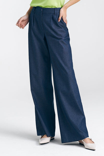Elegantly styled women's wide leg trousers by Nife, featuring a high waist, decorative pleats, and classic pockets, showcased in a refined indigo fabric.