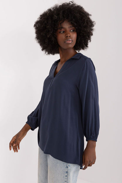Stylish side view of the navy everyday blouse by Sublevel, showcasing its flattering fit and luxurious fabric, ideal for both casual outings and professional environments.