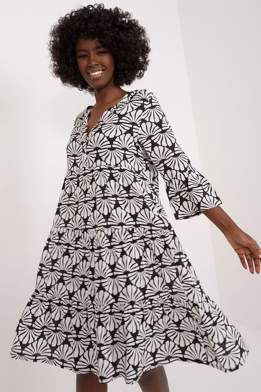 Elegant summer viscose daydress by Sublevel featuring a striking black and white floral print, 3/4 sleeves, and a delicate heart neckline, perfect for casual yet sophisticated occasions.
