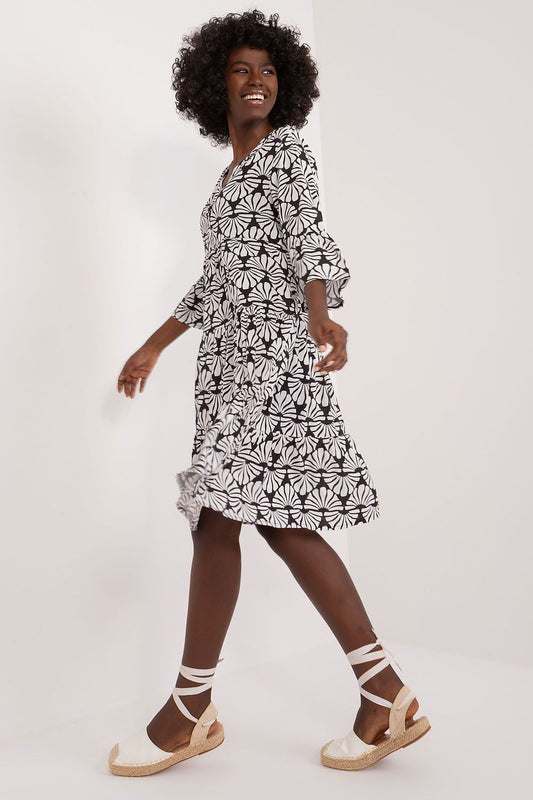Elegant summer viscose daydress by Sublevel featuring a flattering heart neckline, 3/4 sleeves, and a charming floral pattern, perfect for stylish summer outings.