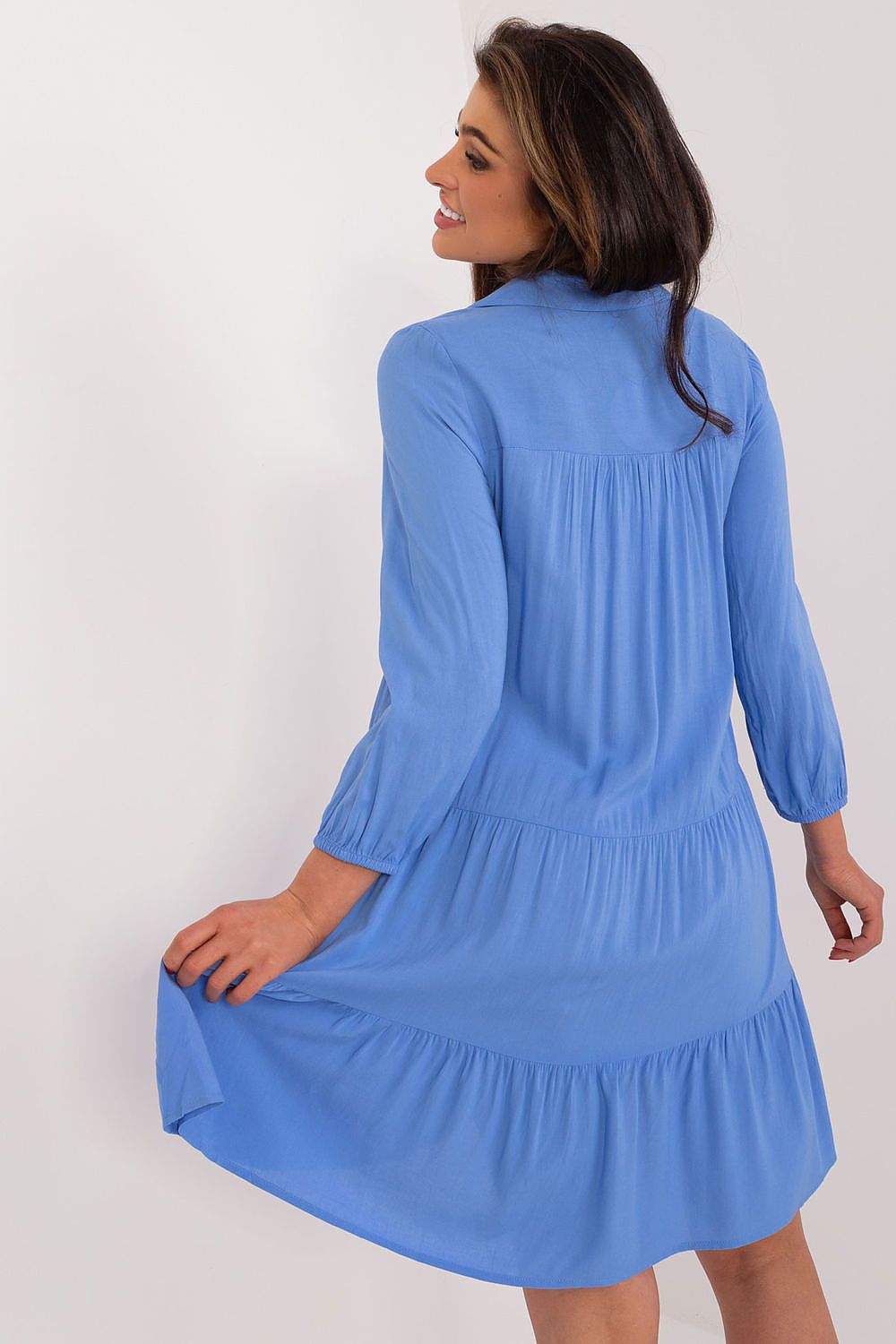 Back view of an oversized summer dress by Sublevel in luxurious lightweight viscose, featuring long sleeves and a flowing tiered design for effortless elegance.