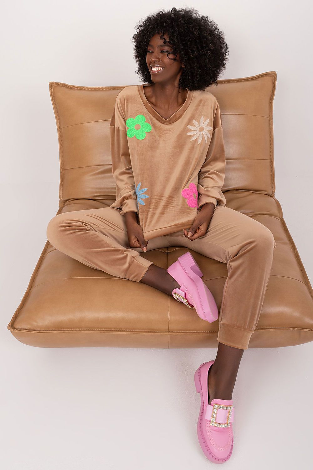 Elegant floral print velour set featuring a long sleeve sweatshirt and high waisted pants, styled beautifully by Italy Moda, perfect for casual luxury.