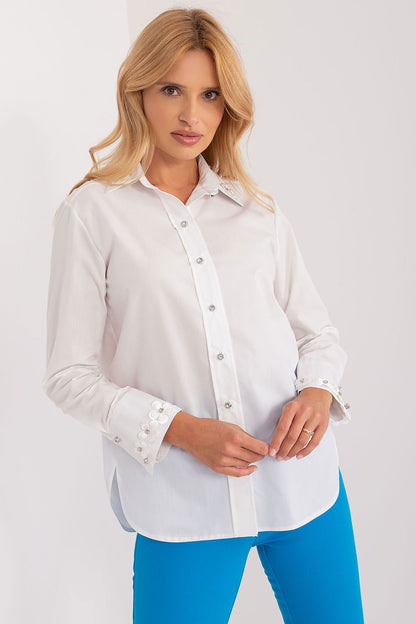 Elegant long sleeve cotton shirt by Lakerta featuring intricate embroidered flowers and decorative zircons on the cuffs, modelled by a stylish woman against a neutral background.