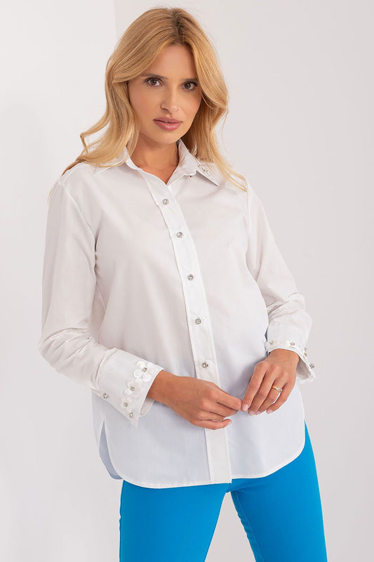 Elegant long sleeve cotton shirt by Lakerta featuring intricate embroidered flowers and decorative zircons on the cuffs, modelled by a stylish woman against a neutral background.