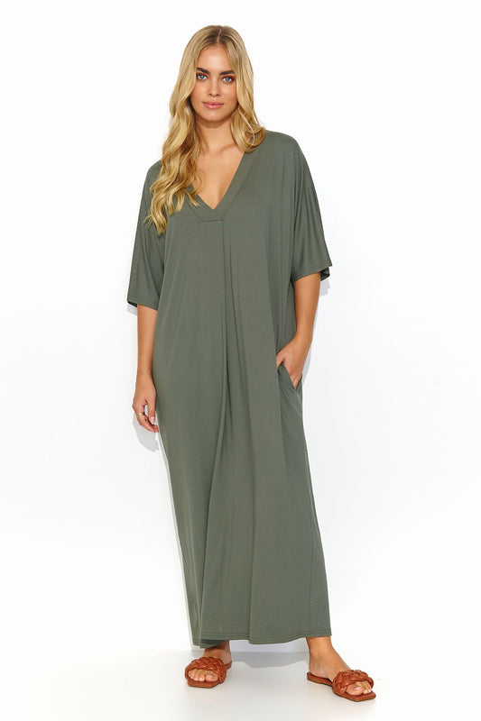 Elegant Makadamia long dress featuring a V neckline and practical pockets, showcased by a model in a serene olive green hue, ideal for summer fashion.