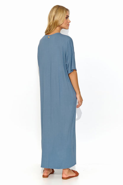 Refined back view of a blue Makadamia long dress, highlighting the sophisticated design and flowing silhouette, perfect for summer outings.