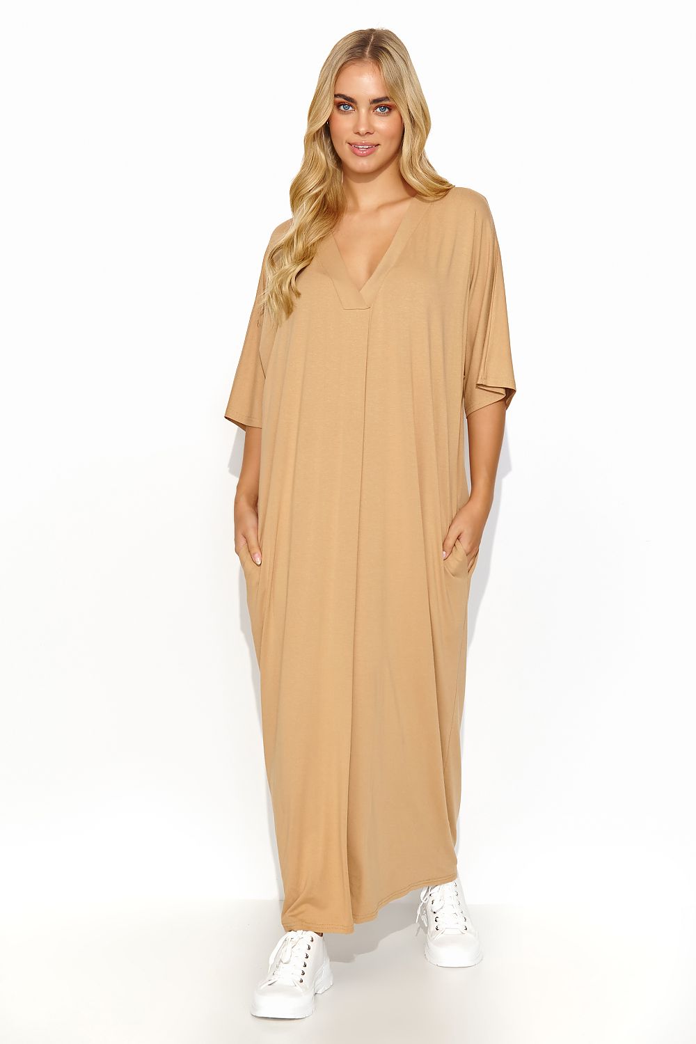 Front view of a stylish beige Makadamia long dress with a contemporary V neckline, elegantly designed for a sophisticated summer look.