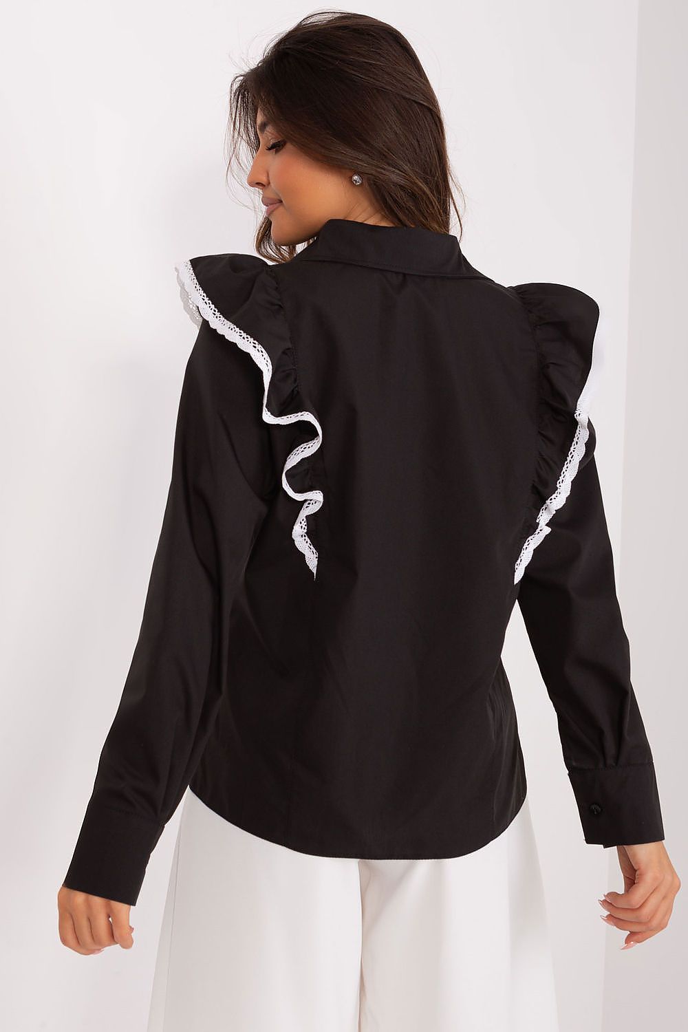 Back view of Lakerta's sophisticated black long sleeve cotton shirt adorned with elegant ruffle and lace detailing, providing a refined look for formal gatherings.