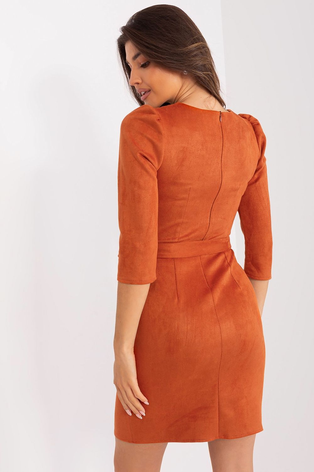 Back view of a Lakerta pencil dress in vibrant orange, featuring stylish puff sleeves and a covered zipper for a polished look, perfect for professional settings.