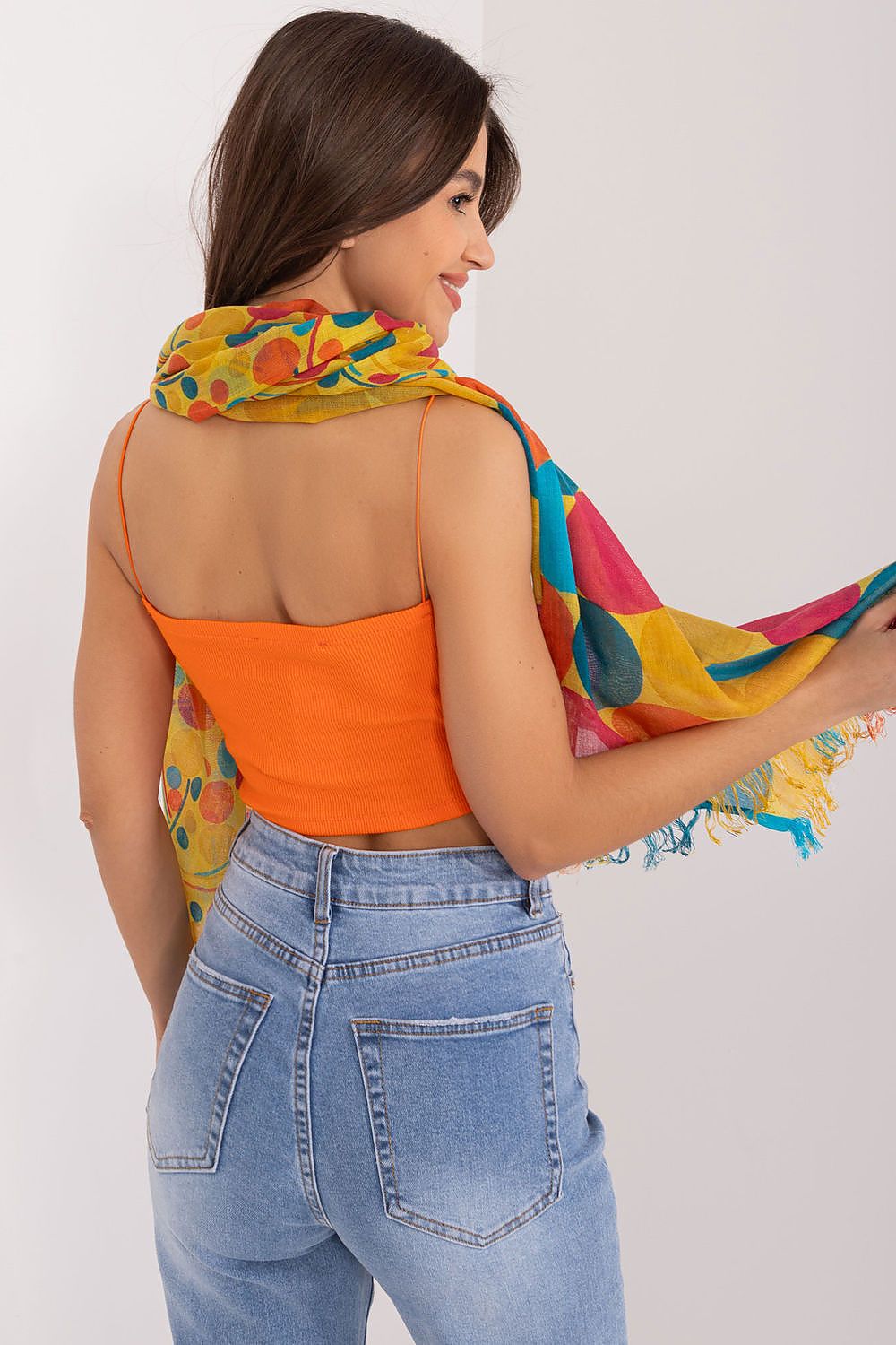 Fashionable 100% cotton neckerchief by AT, displayed on a model with a side view, emphasizing the exquisite design and vibrant colours.