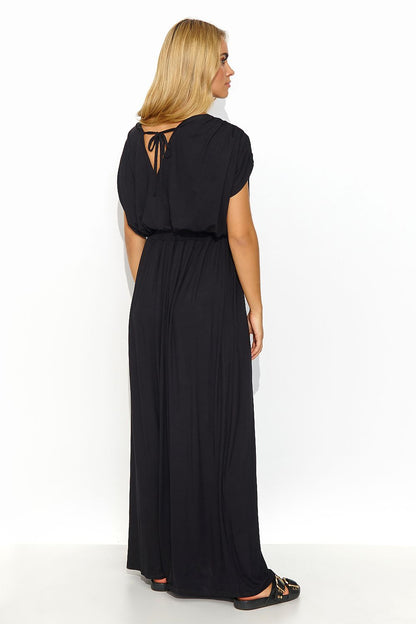 Beautiful Makadamia long lightweight knit daydress in black, with a back tie detail and feminine draping, ideal for adding sophistication to summer gatherings.