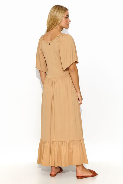 Elegant long dress with ruffles by Makadamia, featuring a stylish back design in a soft beige, perfect for a sophisticated feminine look.