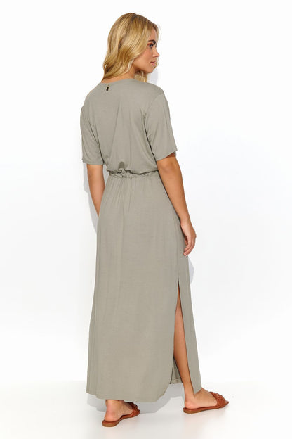 Back view of luxury Makadamia long dress in olive green, showcasing its relaxed fit with a tie waist and feminine design for everyday elegance.