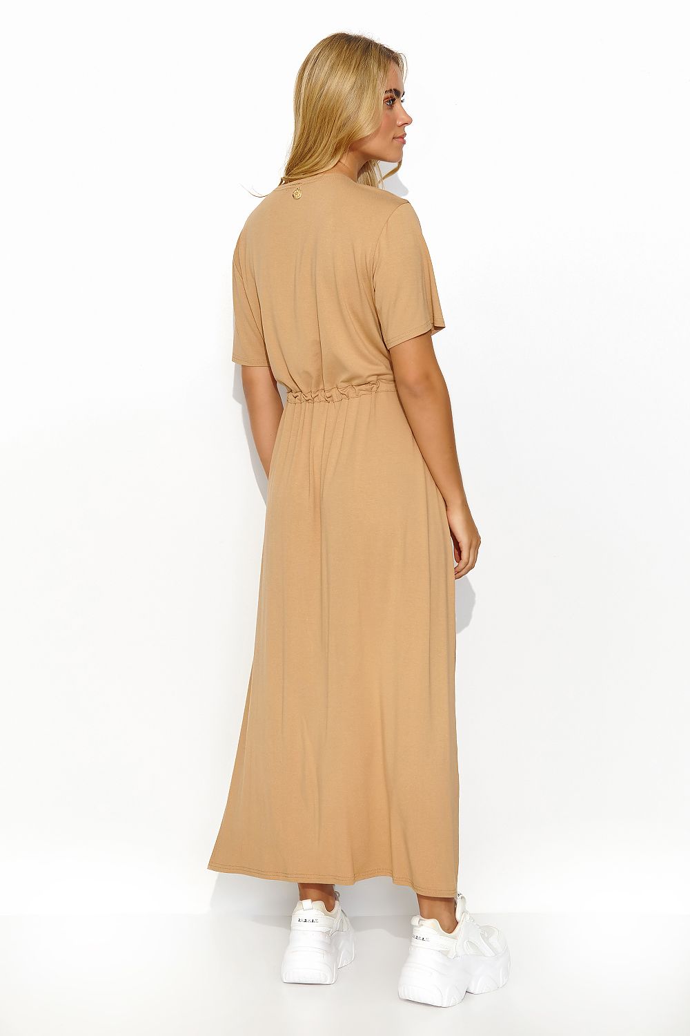 Back view of the caramel long Makadamia dress, highlighting the elegant silhouette and relaxed style, perfect for effortless luxury.