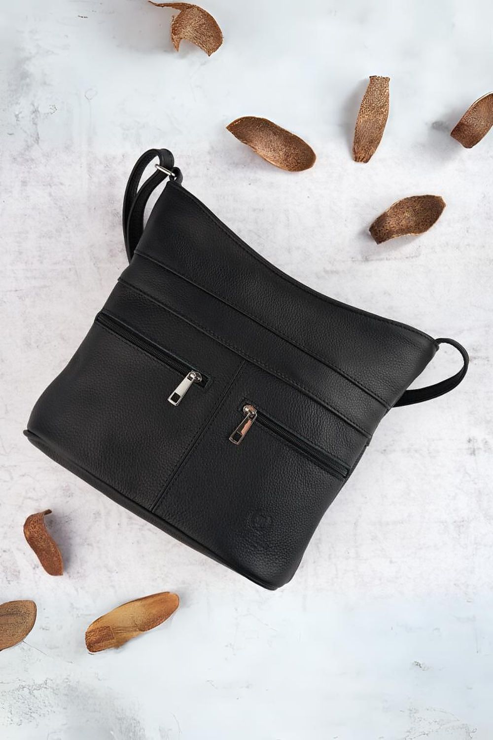 Galanter Women's Natural Leather Zipper Postbag showcasing its elegant design and adjustable strap, perfect for daily luxury use.