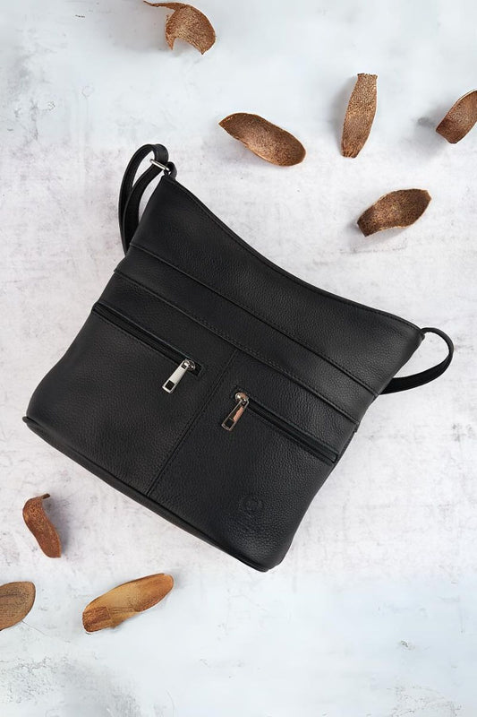 Galanter Women's Natural Leather Zipper Postbag showcasing its elegant design and adjustable strap, perfect for daily luxury use.