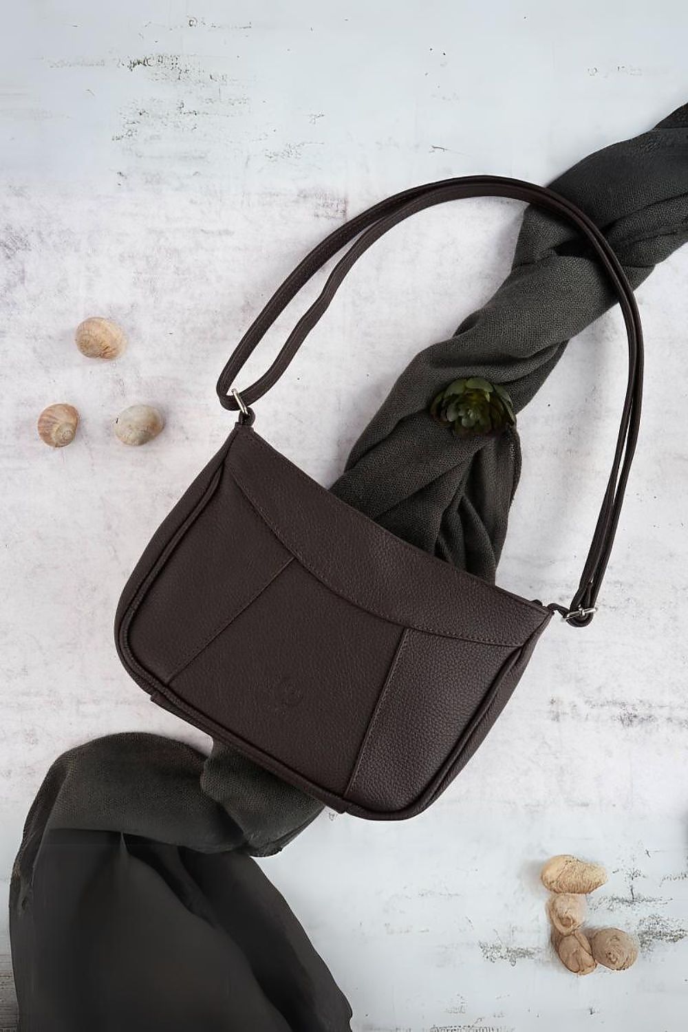 Luxurious brown natural leather handbag by Galanter featuring an adjustable strap and multi-pocket design, showcasing its elegant zippered main compartment and convenient interior slip pocket.