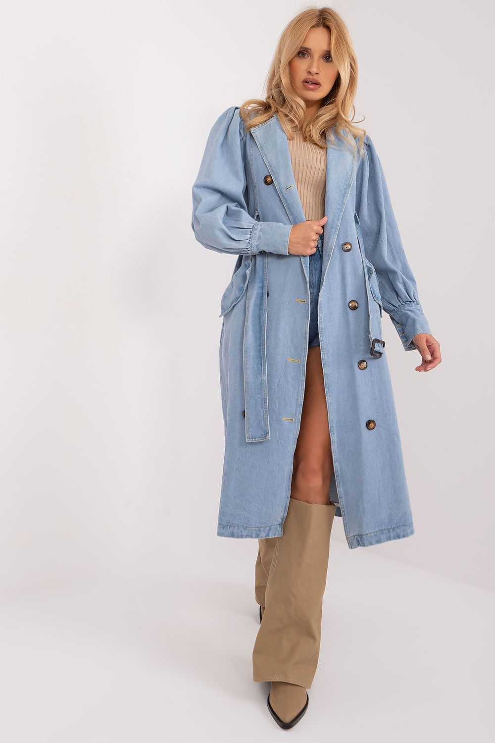Elegant long-sleeve denim trench coat by NM, featuring a double-breasted button closure and chic cuff details.