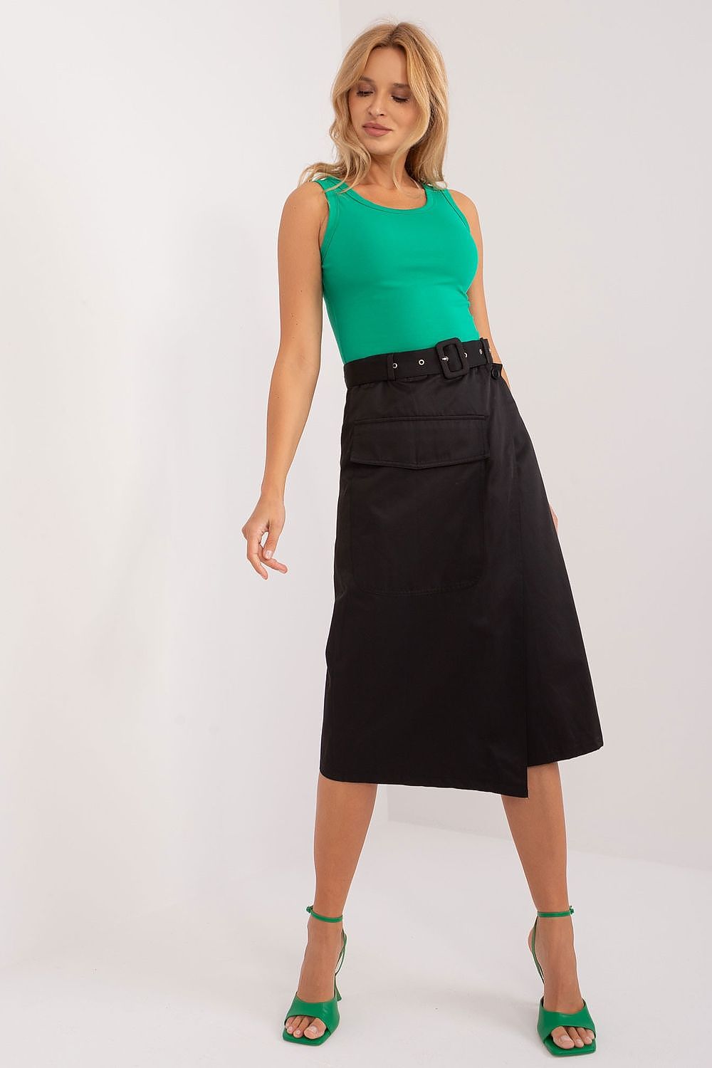 Elegant midi cotton skirt with envelope front, stylish patch pocket, and comfortable fit from Factory Price, ideal for casual and work occasions.