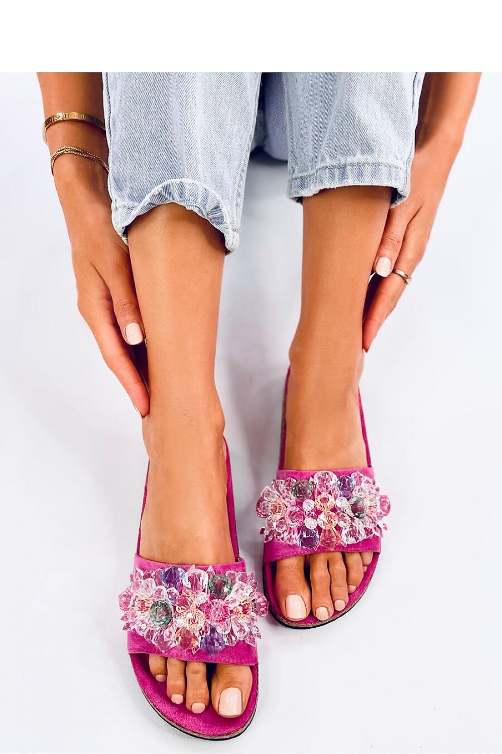Elegant pair of Inello luxury women's flip-flops featuring glittering crystal appliques, set on eco-friendly cork soles, perfect for stylish summer outings.
