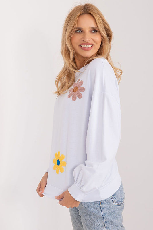 Elegant Italy Moda floral print sweatshirt featuring a round neckline and long sleeves, showcasing its comfort and chic design in a breezy outdoor environment.