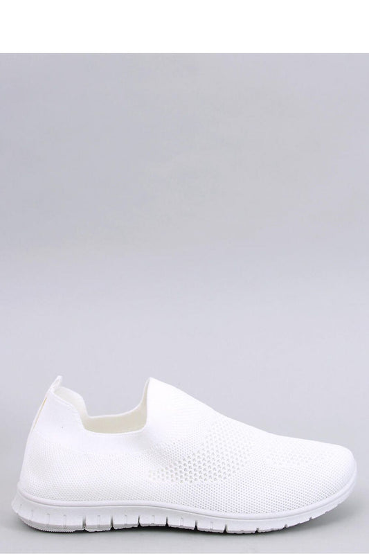 Luxurious Inello women's slip-on sneakers made from airy sock fabric, featuring a springy sole for ultimate comfort, showcased in an elegant display.