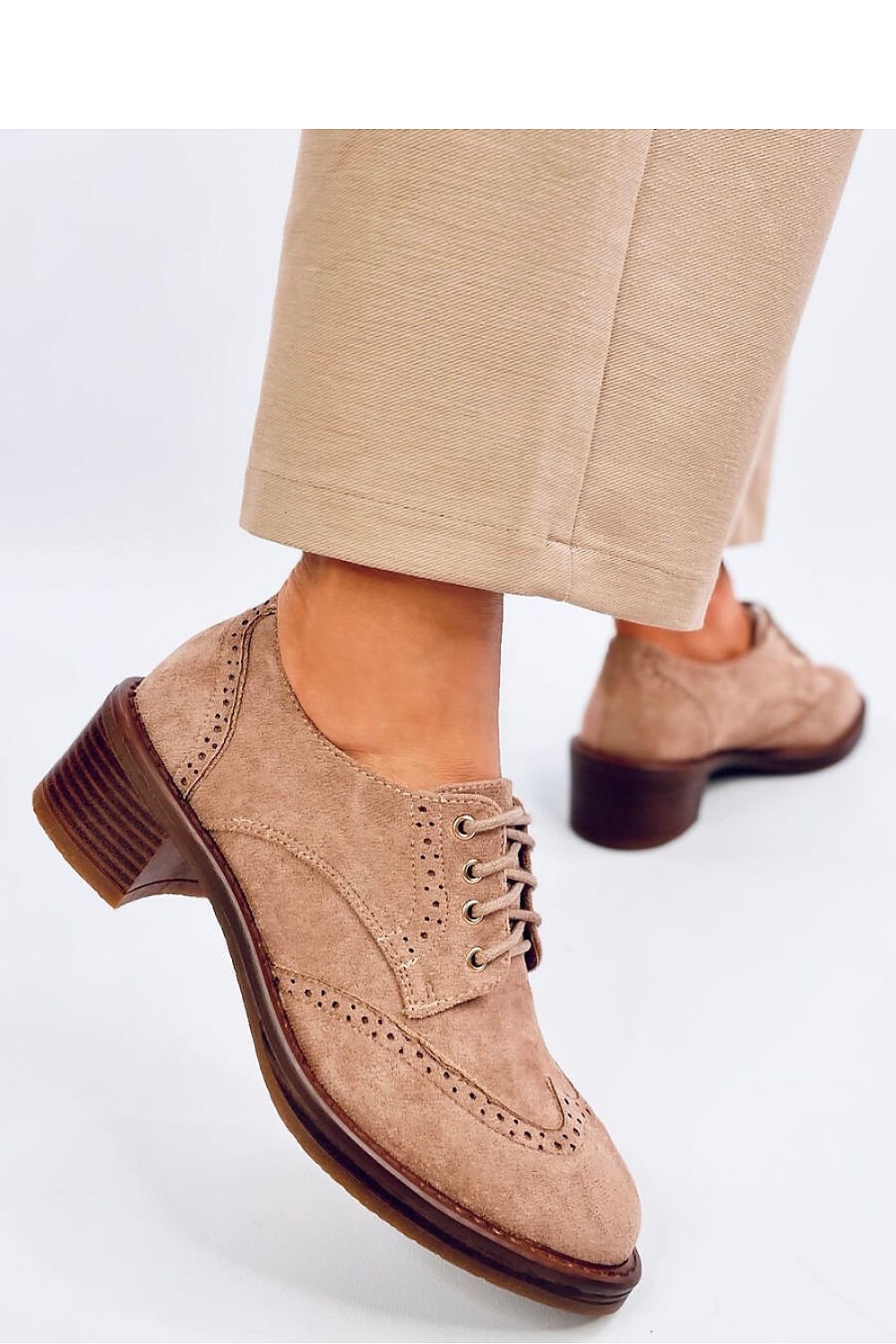 Close-up view of Inello's eco-friendly suede moccasins with a unique pattern, showcasing luxury and comfort in every step.