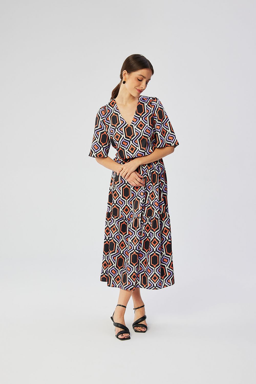 Stylove Women's Printed Maxi Dress with Flared Cut and Ruffled Hem, featuring a V-Neckline for elegant casual wear.