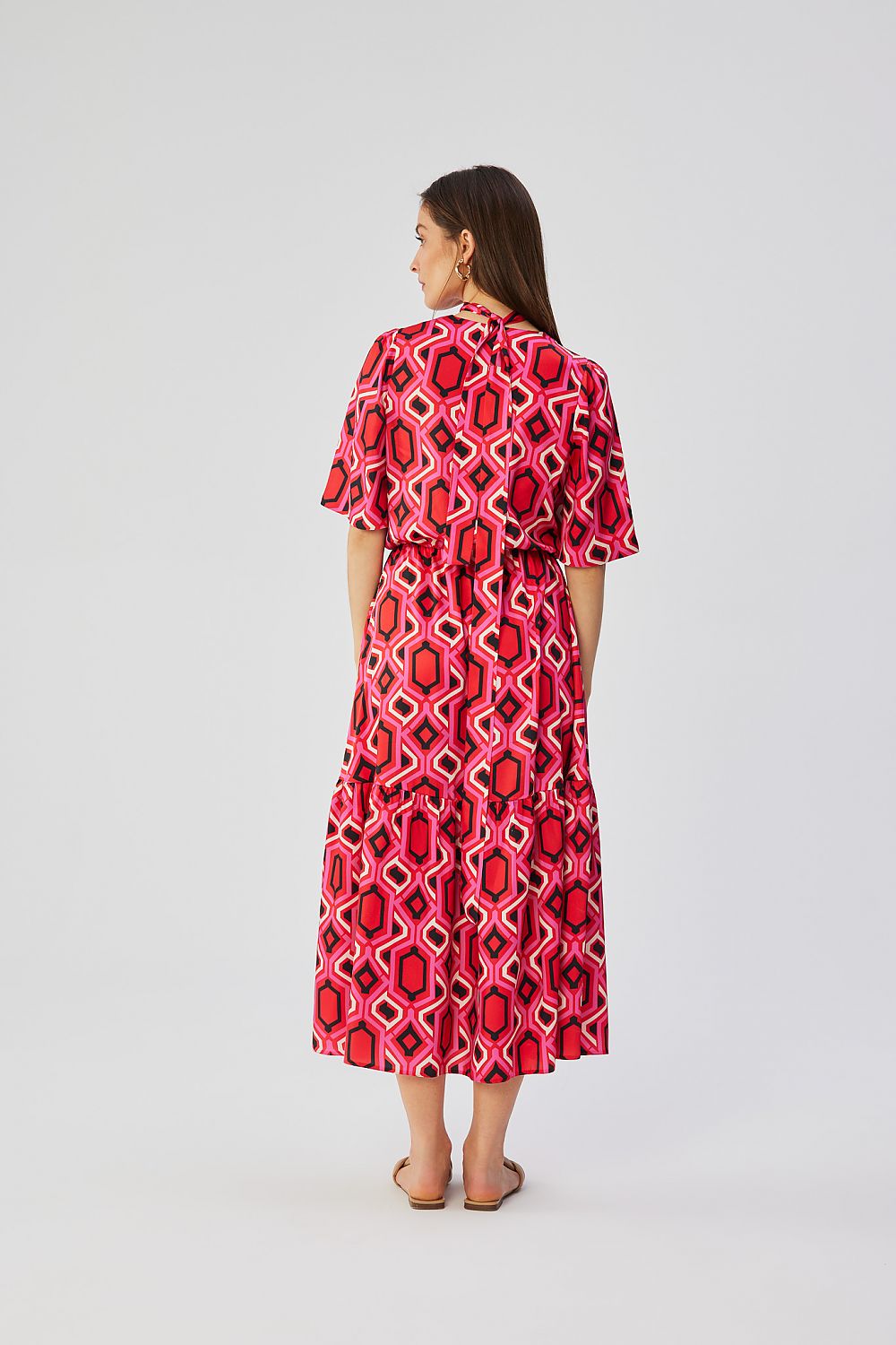 Stylove Women's Maxi Dress displayed on a mannequin, emphasising the chic printed fabric and comfortable elastic waistband.