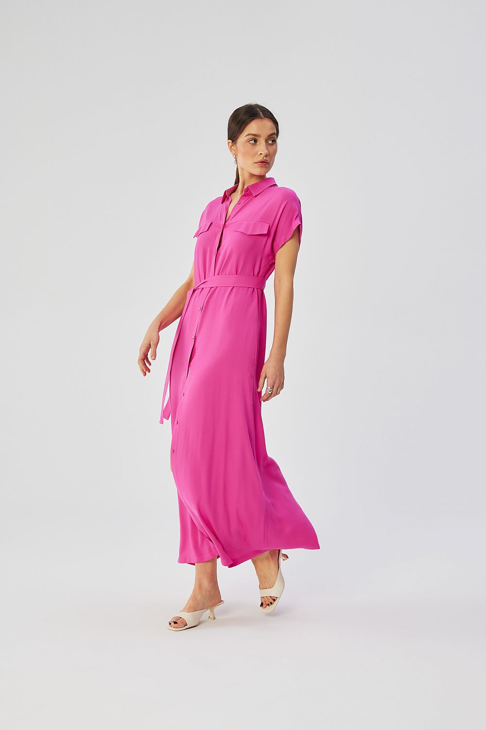 Detail of Stylove maxi dress with button closure and decorative flaps adding a touch of originality and class.
