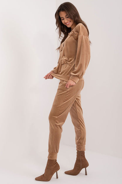 Luxurious Italy Moda velour set featuring an elegant sweatshirt with decorative bows and stylish pants, perfect for casual relaxation.