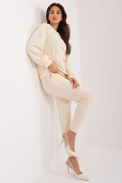 Elegant Italy Moda velour set showcasing luxurious sweatshirt and pants with decorative bows, perfect for stylish casual wear.