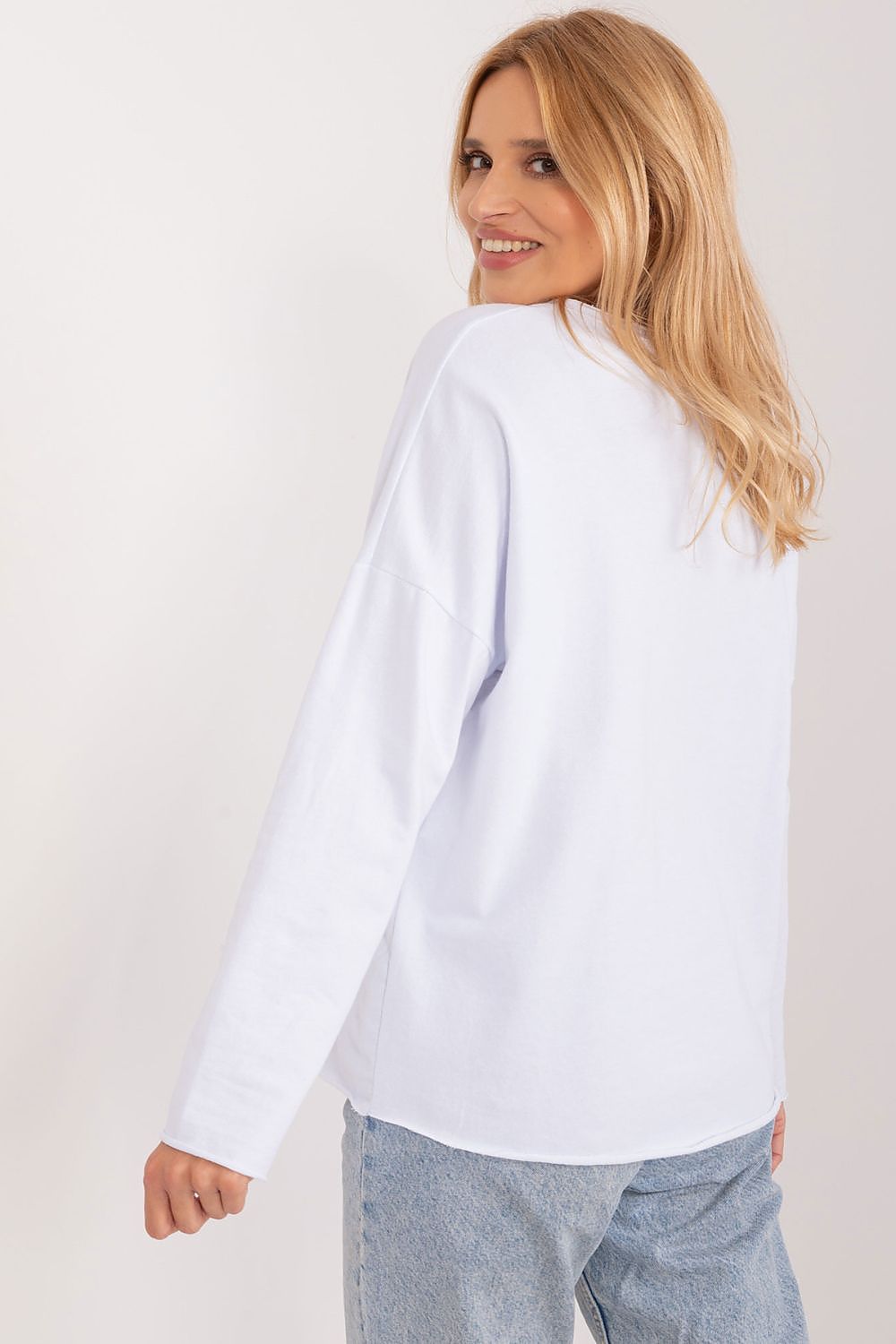 Model wearing the Italy Moda Floral Print Casual Blouse, highlighting its flattering heart neckline and sophisticated long sleeves, ideal for versatile occasions.