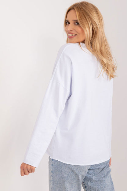 Model wearing the Italy Moda Floral Print Casual Blouse, highlighting its flattering heart neckline and sophisticated long sleeves, ideal for versatile occasions.
