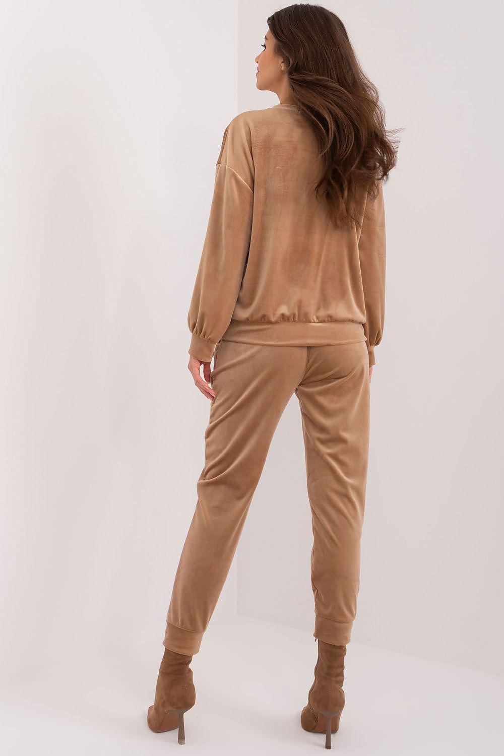 Close-up of Italy Moda velour fabric showcasing its soft texture and elegant design, part of the luxurious sweatshirt and pants combo.