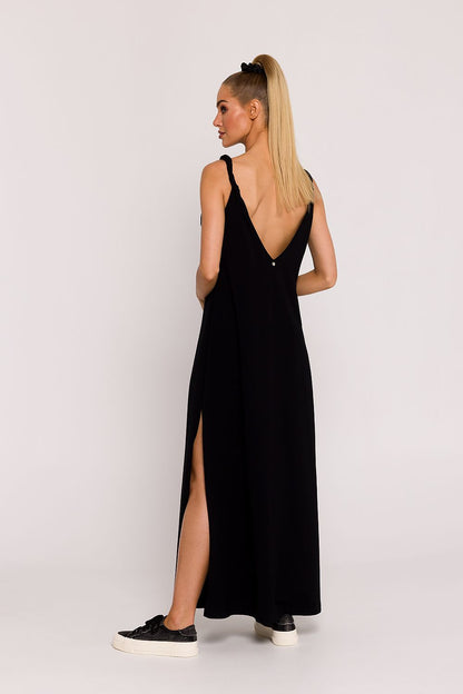 Elegant back view of the Moe Oversized Knit Dress with deep V-neckline and decorative blacktop, designed for comfort and sophistication, ideal for trendy and fashionable women.