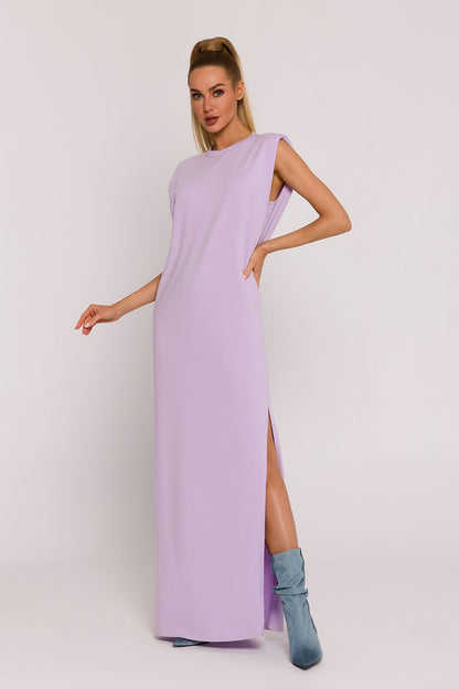 Elegant side view of Moe's luxury oversized knit dress, highlighting its airy fabric and unique style, ideal for expressing individual fashion sense.