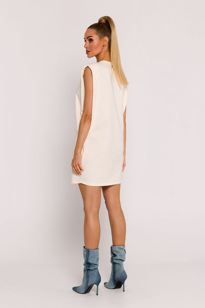 Moe oversized knit dress displayed on a model, illustrating the comfortable fit and stylish shoulder pads, perfect for sophisticated summer occasions.