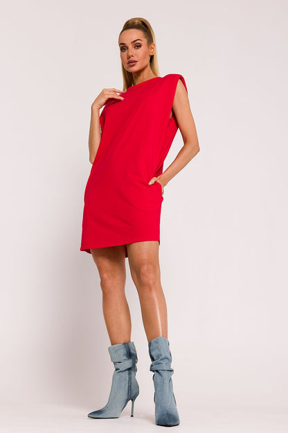 Elegant oversized knit dress by Moe featuring stylish shoulder pads and refined side pockets, highlighting polished craftsmanship and modern aesthetics.