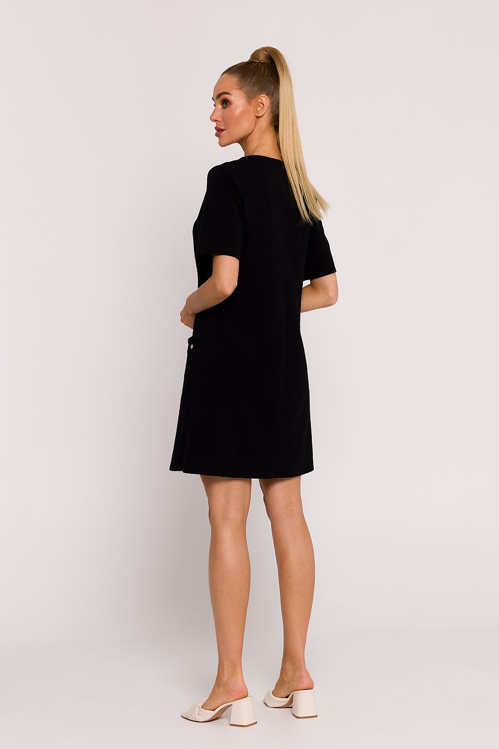 Elegant Moe A-Line Knit Dress with Pockets, crafted from a premium cotton blend, showcasing its refined short sleeves and sophisticated silhouette, perfect for summer occasions.