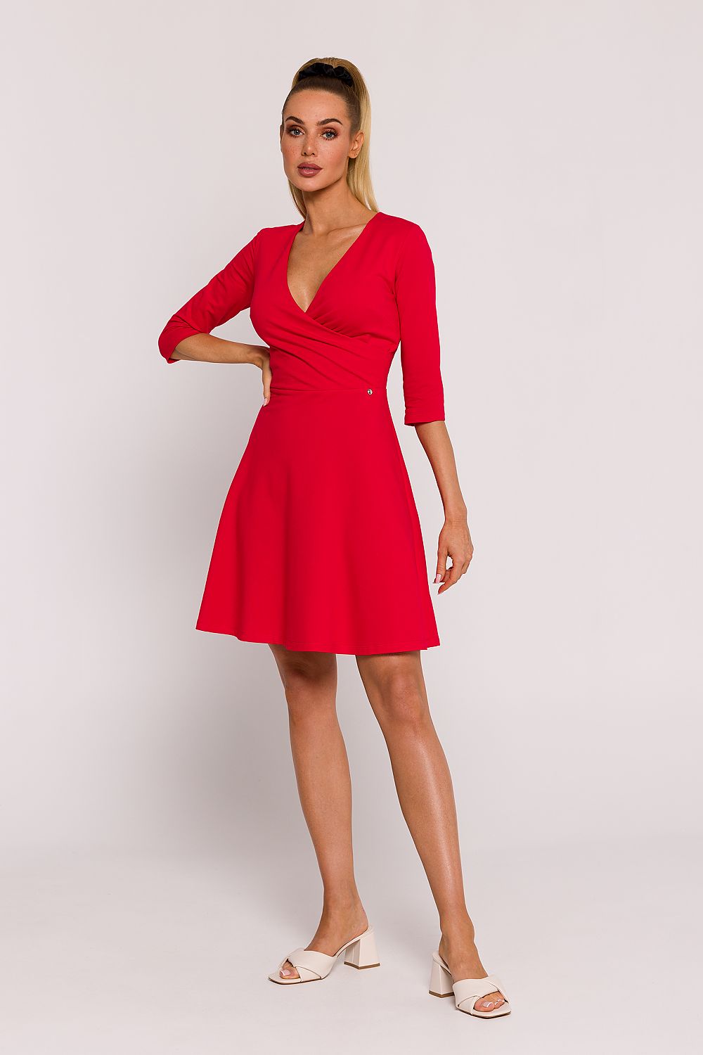Moe Elegant Mini Knit Dress in airy flared cut, showcasing exquisite Polish craftsmanship and unique elbow-length sleeves.