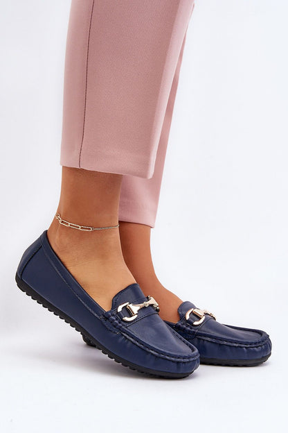 Elegant eco leather moccasin shoes with gold embellished strap, showcased on a model, designed by Step in Style for a luxurious summer look.