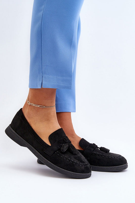 Luxurious black eco-suede moccasins with a stylish bow detail, worn elegantly by a model in blue trousers, perfect for all-day comfort from Step in Style.