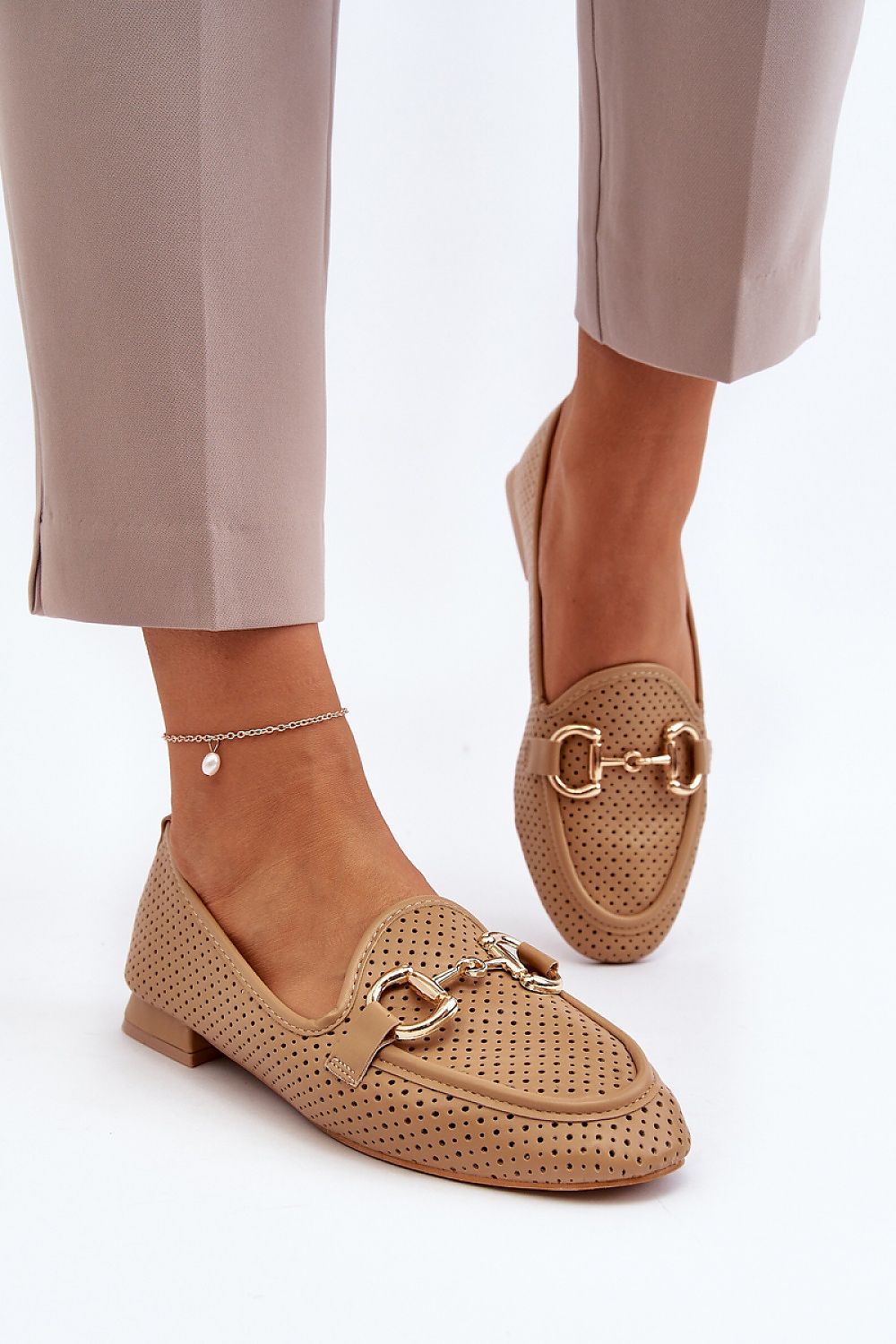 Versatile and elegant moccasins by Step in Style, presented in eco leather with a charming front ornament for added sophistication.